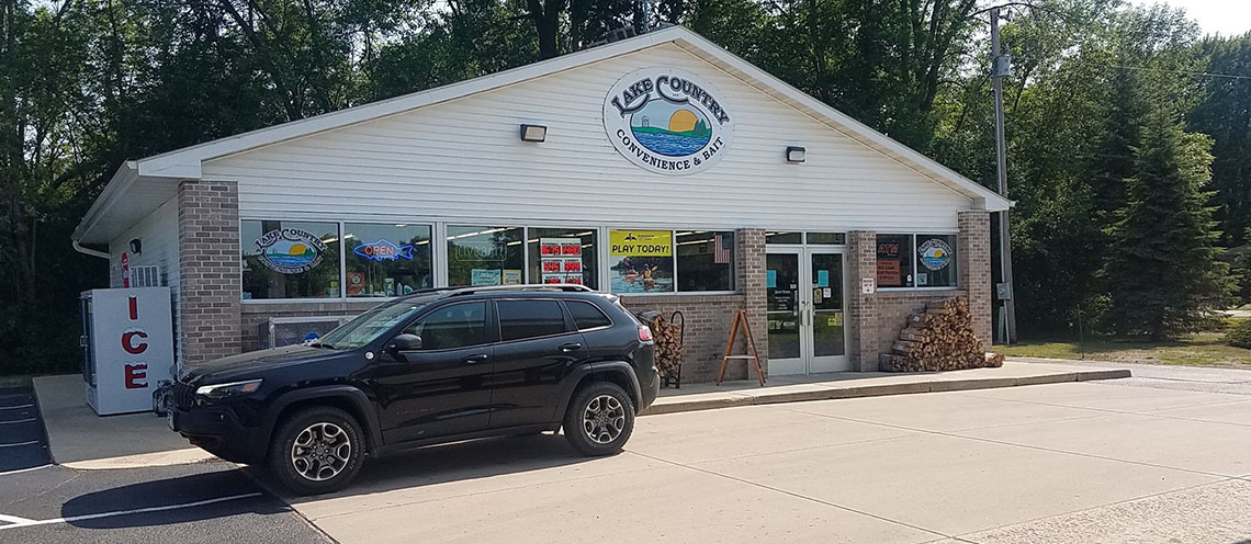 Truck filling its gas tank at Lake Country Convenience & Bait